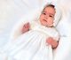 Sarah Louise 001199s Embroidered Cotton Voile Dress & Bonnet on baby lying down